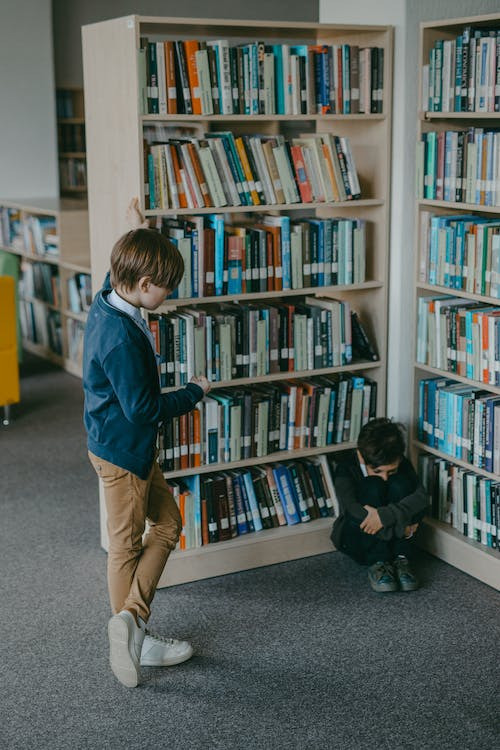 Two kids in a library