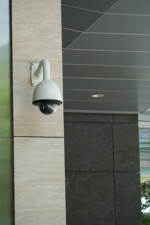 A security camera mounted on a pillar