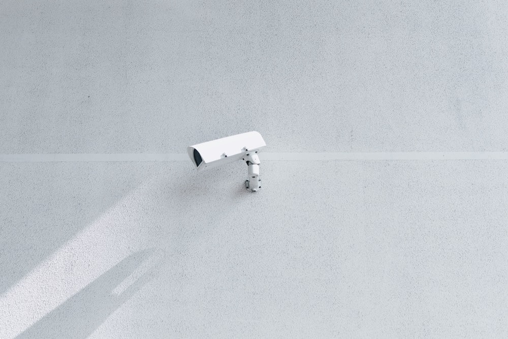 a camera installed on a white wall.