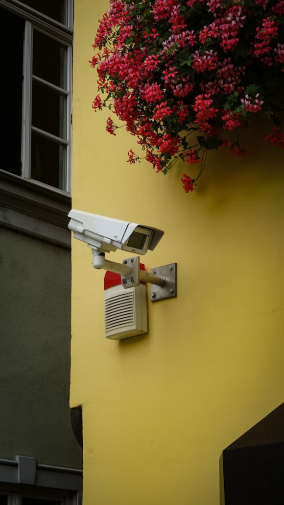 An entrance of a restaurant with a CCTV camera above the door.
