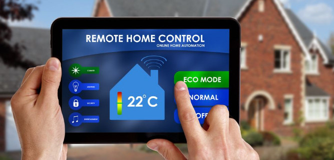 A person holding a tablet remote home automation controls