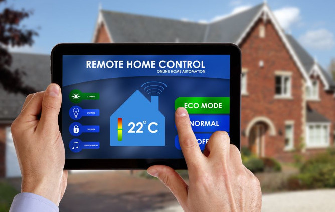 A person holding a tablet remote home automation controls